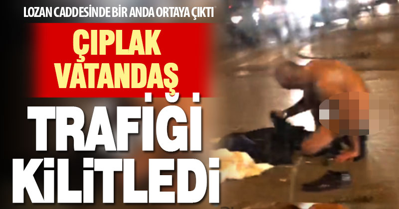 Lozan Caddesinde yolun ortasında soyunan yurttaş trafiği aksattı