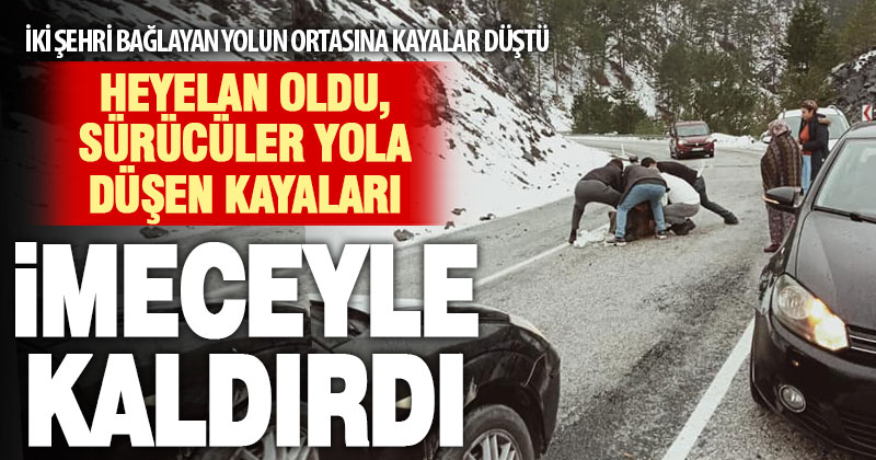 Yola düşen kaya parçasını sürücüler imeceyle kaldırdı