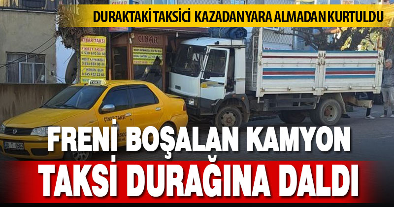 Freni boşalan kamyon taksi durağına daldı