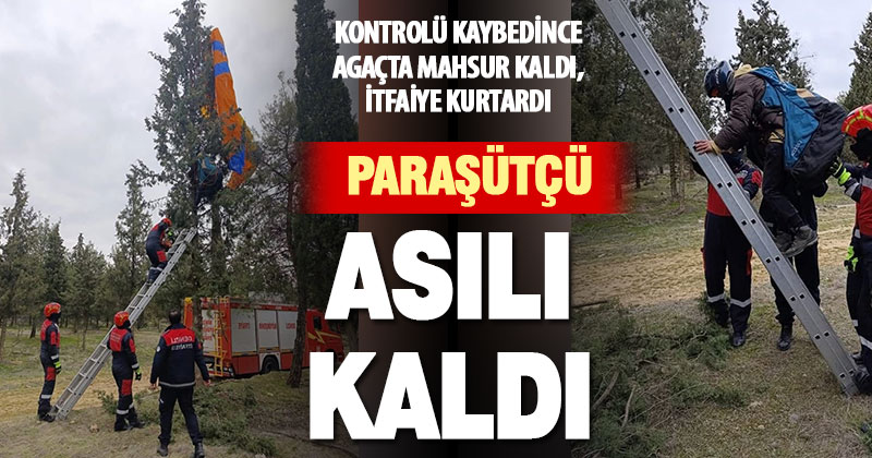 Ağaçta asılı kalan yamaç paraşütçüyü itfaiye kurtardı