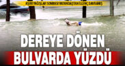 Aşırı yağış sonrası bir vatandaş dereye dönen bulvarda yüzdü